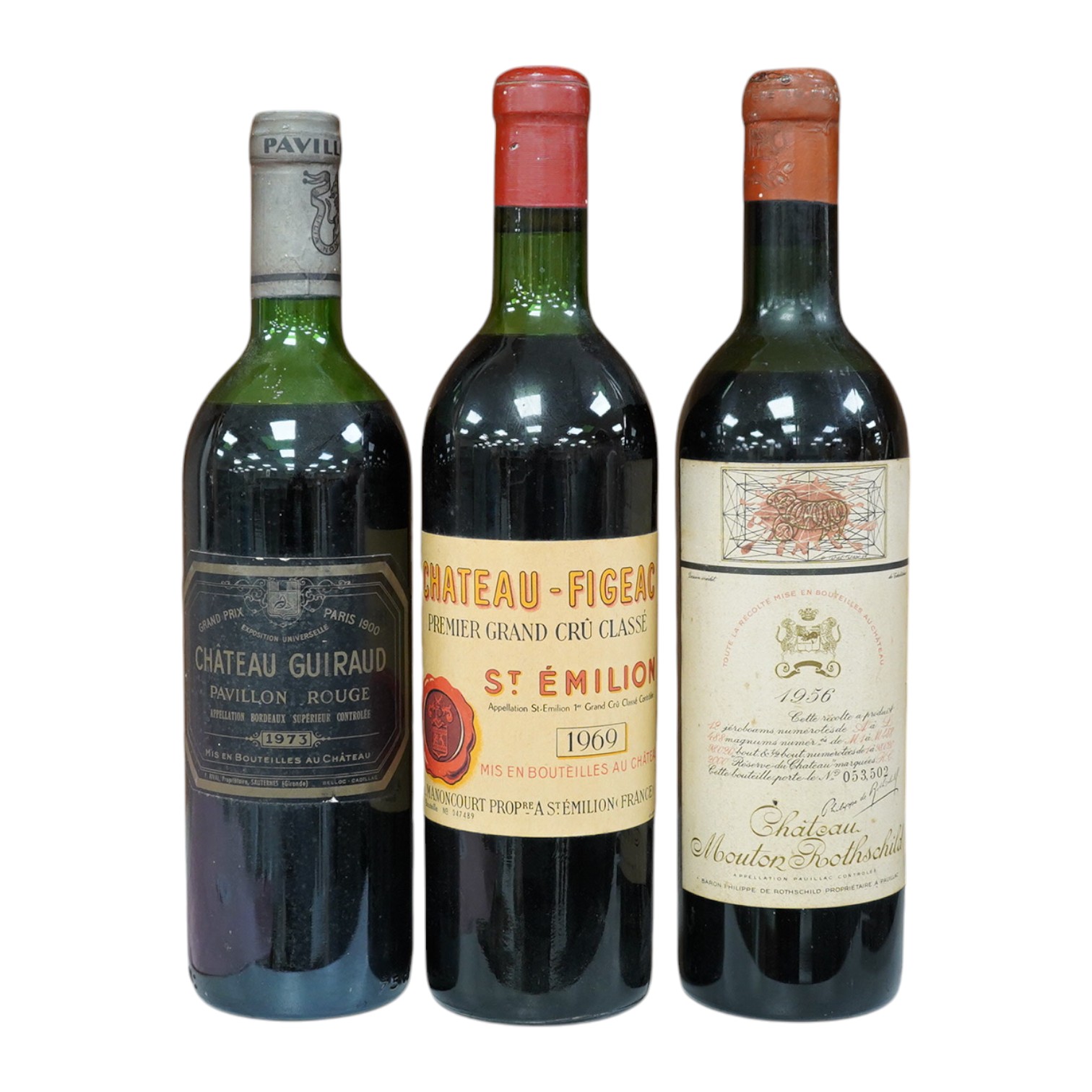 Three bottles including; Chateau Mouton Rothschild 1956, Château Guiraud Pavillon Rouge 1973 and Chateau Figeac St Emilion 1969. Condition - fair.